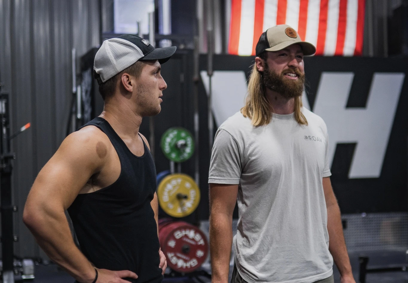 Joey talking with a client in the gym