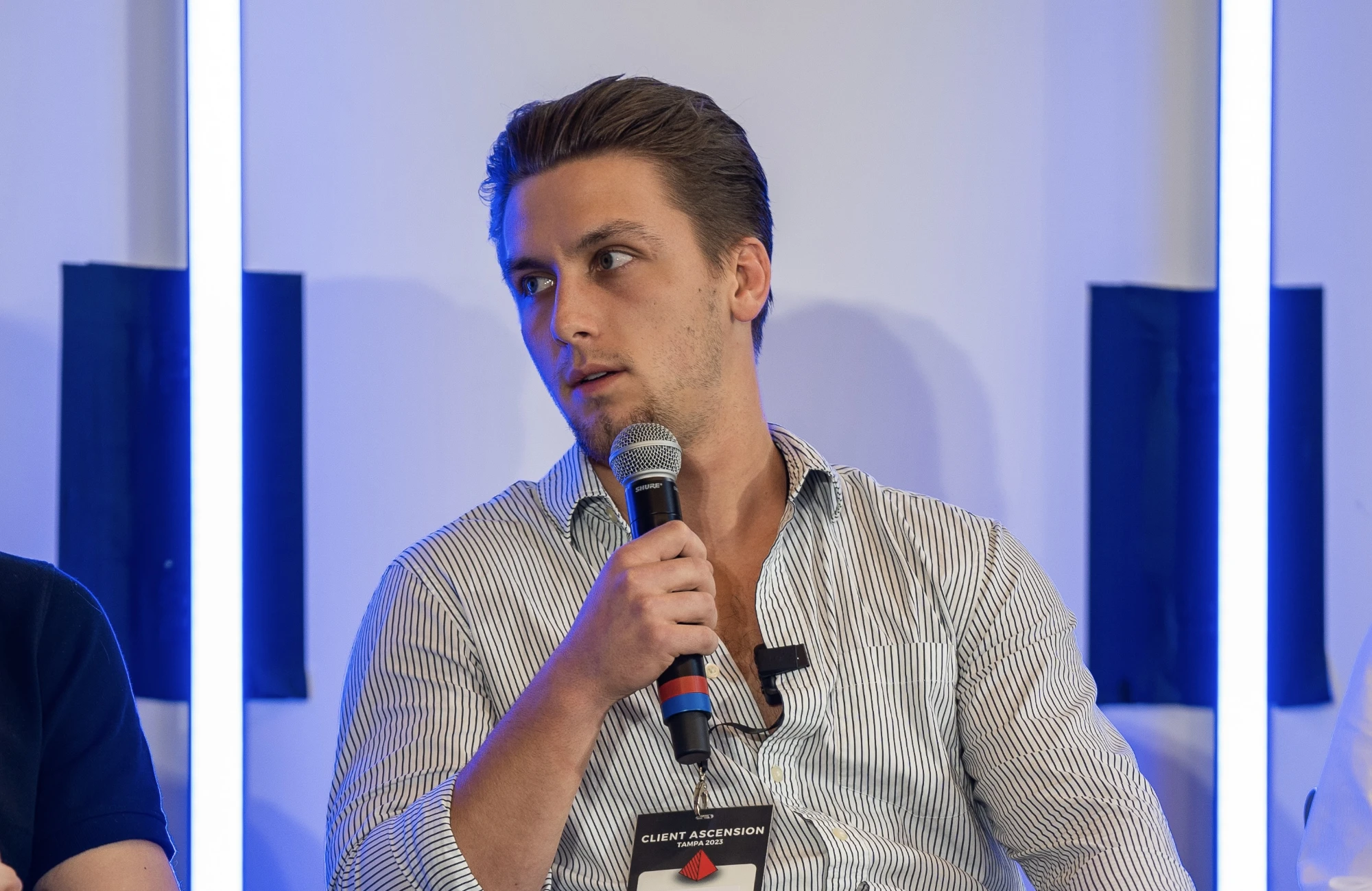 Joey speaking on a panel at an industry event
